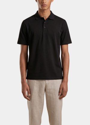 Front view of a person wearing a black polo shirt with short sleeves and beige trousers.