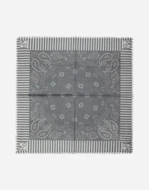 Gray bandana with paisley and floral patterns, bordered by vertical stripes and fringed edges.