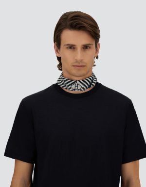 Male model wearing a black t-shirt with a striped patterned neck scarf around the neck.
