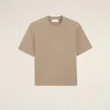 Beige short-sleeve crewneck T-shirt laid flat on a pale background, with a small chest emblem.