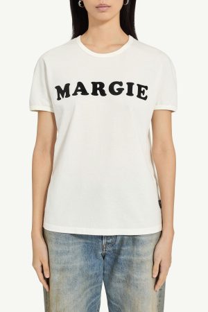 White crew-neck T-shirt with the word 'MARGIE' in bold black letters worn by a model on blue jeans front viewiside.