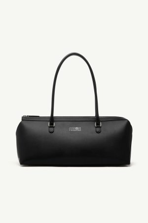 Black leather duffel bag with two rounded top handles and a top zipper closure, minimal branding on the front