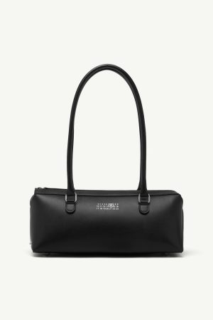 Black leather handbag with two top handles and a zip closure, minimalist design.