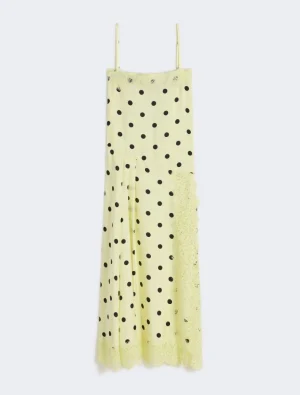 Yellow polka-dot spaghetti-strap maxi dress with lace trim at the hem.
