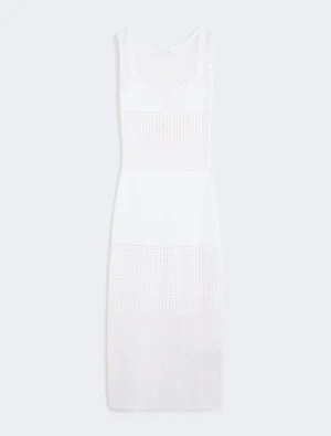 White sleeveless mesh dress with sheer panels and a fitted silhouette.