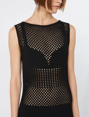 Black sleeveless knit top with a diamond mesh pattern, form-fitting on a model's torso.