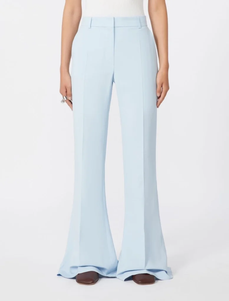 Light blue wide-leg trousers with front creases, full length, paired with brown shoes