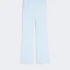 Light blue tailored dress pants with pressed creases and a straight leg, laid flat