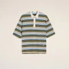 Striped polo shirt on a hanger against a light beige background; olive green, blue, and tan stripes with a cream collar and placket, centered in frame.