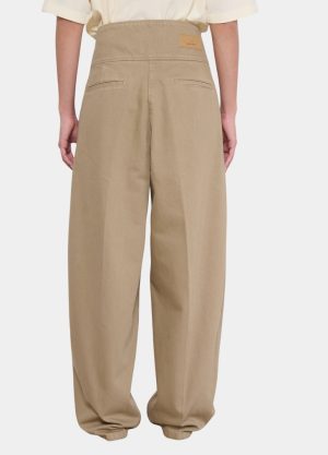 Back view of wide-leg khaki pants with a high waist and back welt pockets; beige casual trousers on a pale background