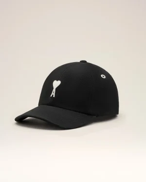 Black baseball cap with white embroidered letter A and heart on the front panel