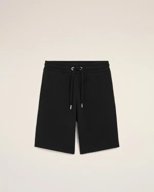 Front view of black shorts with a drawstring waist and metal-tipped ends, against a light beige background.