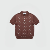 Brown short-sleeve polo shirt with small white pearl-like beads arranged in rows across the front.