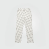 Untitled design - 1 - New Trend White pants with evenly spaced black polka dots on a light background, full-length and straight-leg fit.