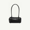 Small black leather handbag with two short handles, centered against a pale background.