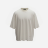 White oversized crew-neck T-shirt with dropped shoulders and short sleeves.