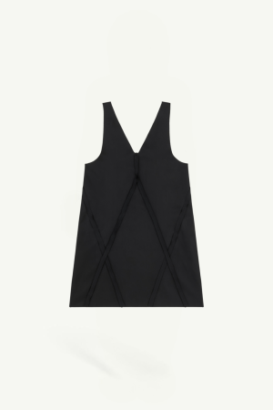 Front view of a black sleeveless V-neck top with decorative crisscross seam panels forming a subtle geometric pattern.