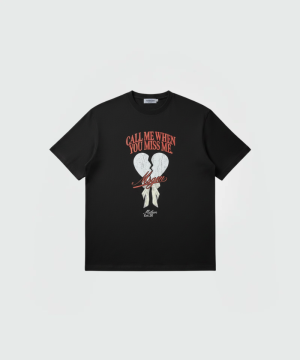 Black T-shirt with a graphic of a cracked heart and red script text reading 'CALL ME WHEN YOU MISS ME' above a signature-like word.