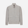 Light patterned zip-up jacket with a stand collar and two front patch pockets viewed front-on.