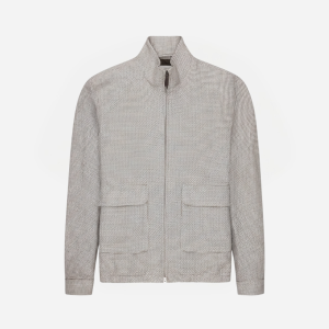 Light patterned zip-up jacket with a stand collar and two front patch pockets viewed front-on.