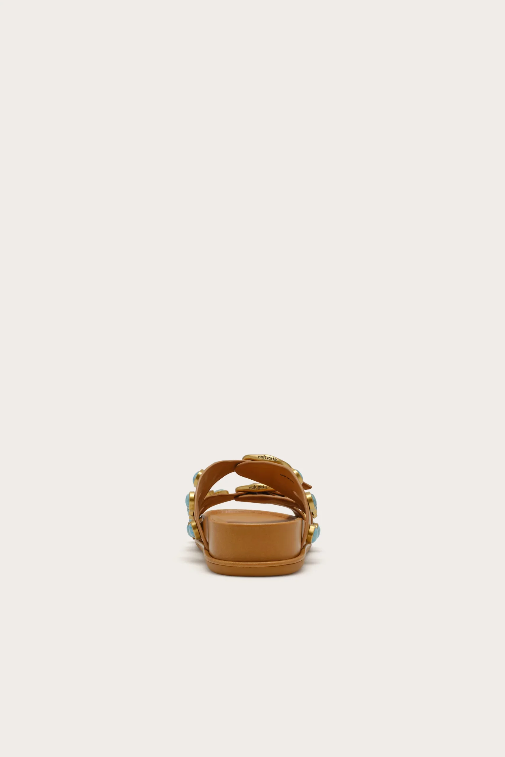 IMG_1269 - New Trend Tan open-toe sandal with straps and turquoise accents, centered on a light background.