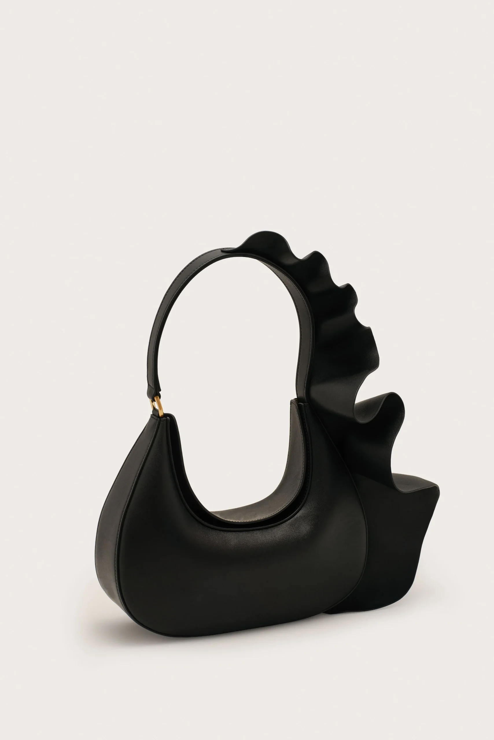 IMG_1281 - New Trend Black leather handbag with a large circular handle and sculpted wavy top edge.