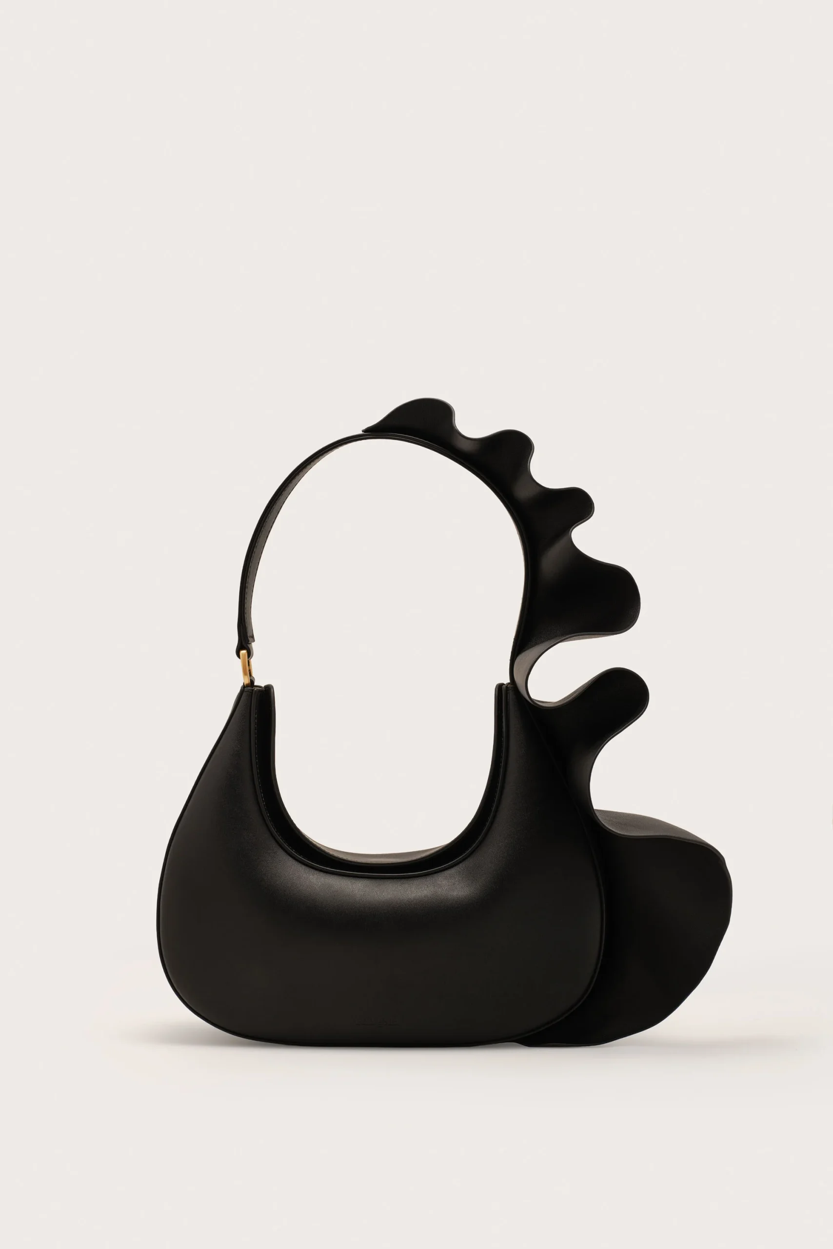 IMG_1283 - New Trend Black handbag with a circular opening and a wavy, sculpted strap detail on the right side against a light background