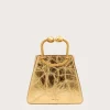 IMG_1294 - New Trend Gold-toned metallic handbag with a rounded hinge handle against a pale background, front view