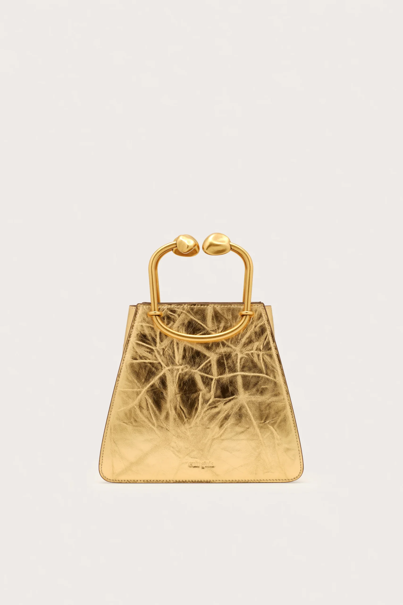 IMG_1294 - New Trend Gold-toned metallic handbag with a rounded hinge handle against a pale background, front view