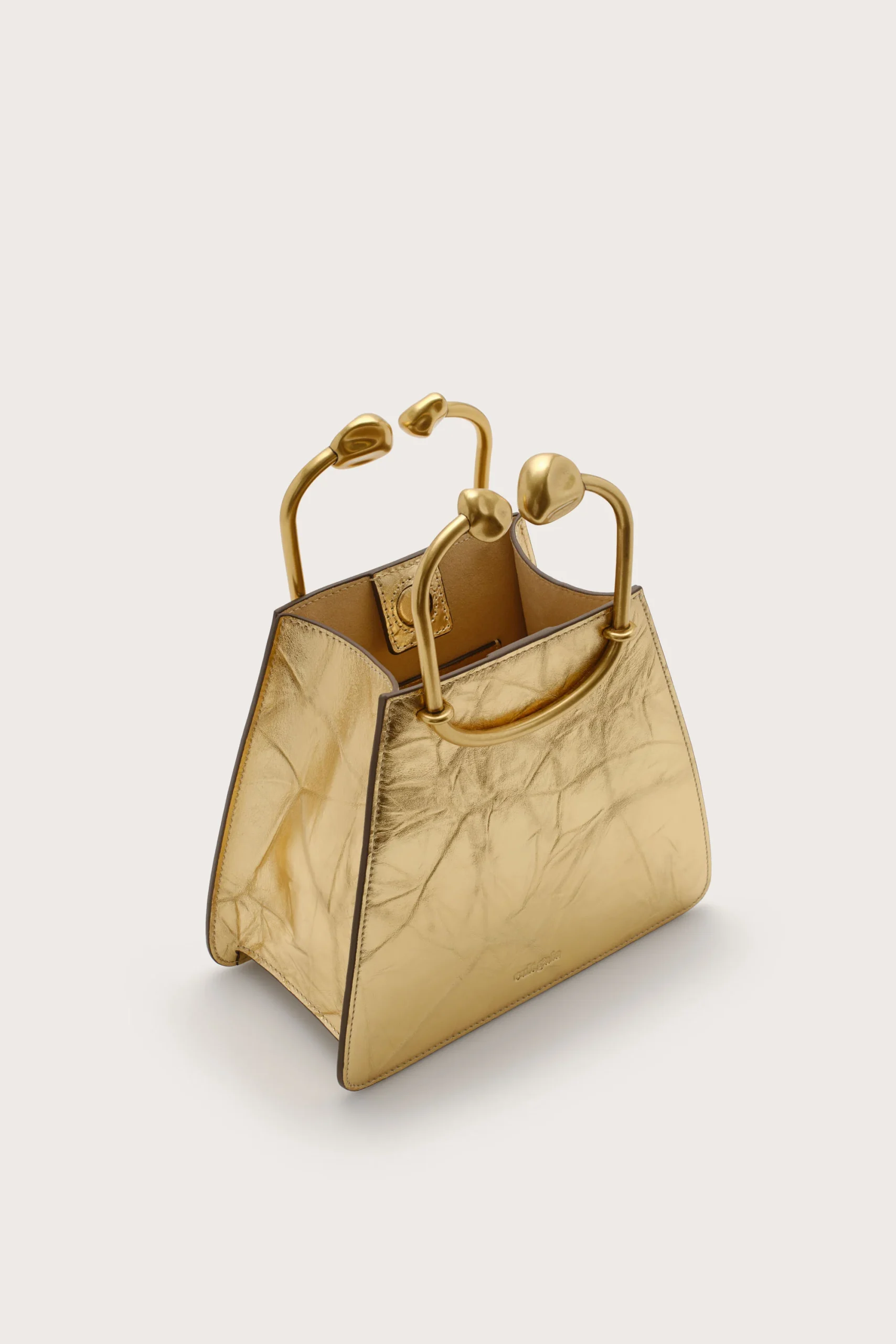 IMG_1296 - New Trend Gold metallic handbag with rounded top handles, structured leather design and subtle stitching detail.
