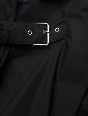 Black fabric with a silver metal belt buckle and grommets, fastened across the material.