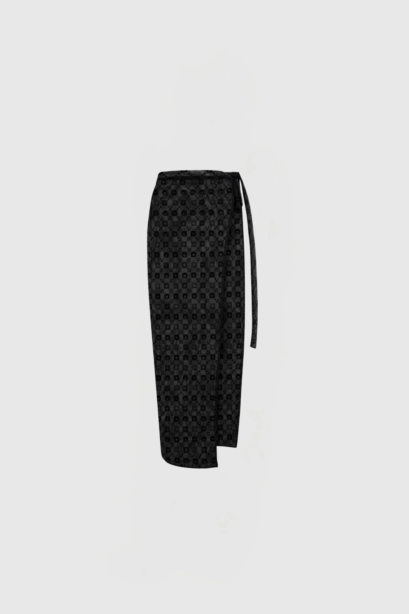 Untitled design - New Trend Black tie with a small circular pattern, hanging against a pale gray background (cropped at the bottom).