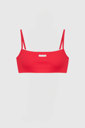 Red spaghetti-strap bikini top on a white mannequin, front view with a small label at the center.