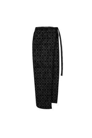 Long black scarf with a subtle repeating geometric pattern, hanging vertically.