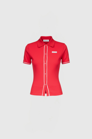 Red polo-style top with a collared neck, white piping along the placket and sleeve cuffs, displayed on a white background.