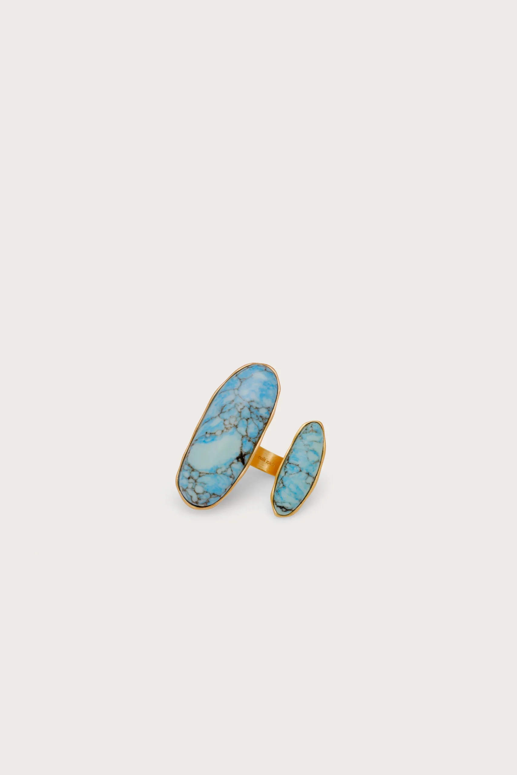 IMG_1424 - New Trend Gold-plated jewelry set with blue turquoise stones arranged as two long oval pieces and a matching band on a pale background