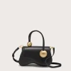 IMG_1565 - New Trend Black leather handbag with gold spherical hardware on each handle, set against a pale background.