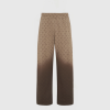 Untitled design - New Trend Beige trousers with a repeating brown crescent pattern shown from the waist to the lower legs against a light background.