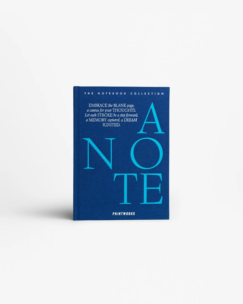 IMG_2408 - New Trend Blue hardcover notebook titled 'A NOTE' from Printworks with large cyan letters and an inspirational quote on the cover.
