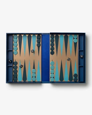 Open backgammon set with teal and dark pieces on brown boards, two dice on the board.