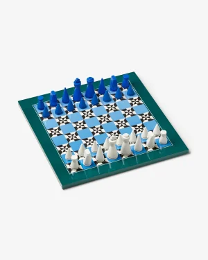 Chessboard with blue pieces at the top and white pieces at the bottom, arranged in the starting position."