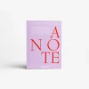 IMG_2528 - New Trend Lavender notebook with large red letters forming 'NOTE' across the cover; small white text at the top reads 'The Notebook Collection'