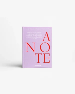 Lavender notebook with large red letters forming 'NOTE' across the cover; small white text at the top reads 'The Notebook Collection'