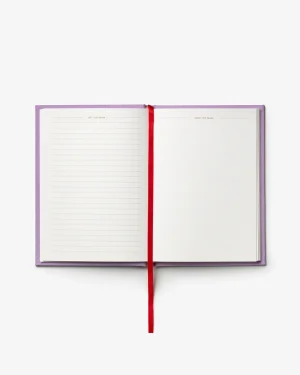 Open notebook with purple cover and red bookmark, left page lined, right page blank.