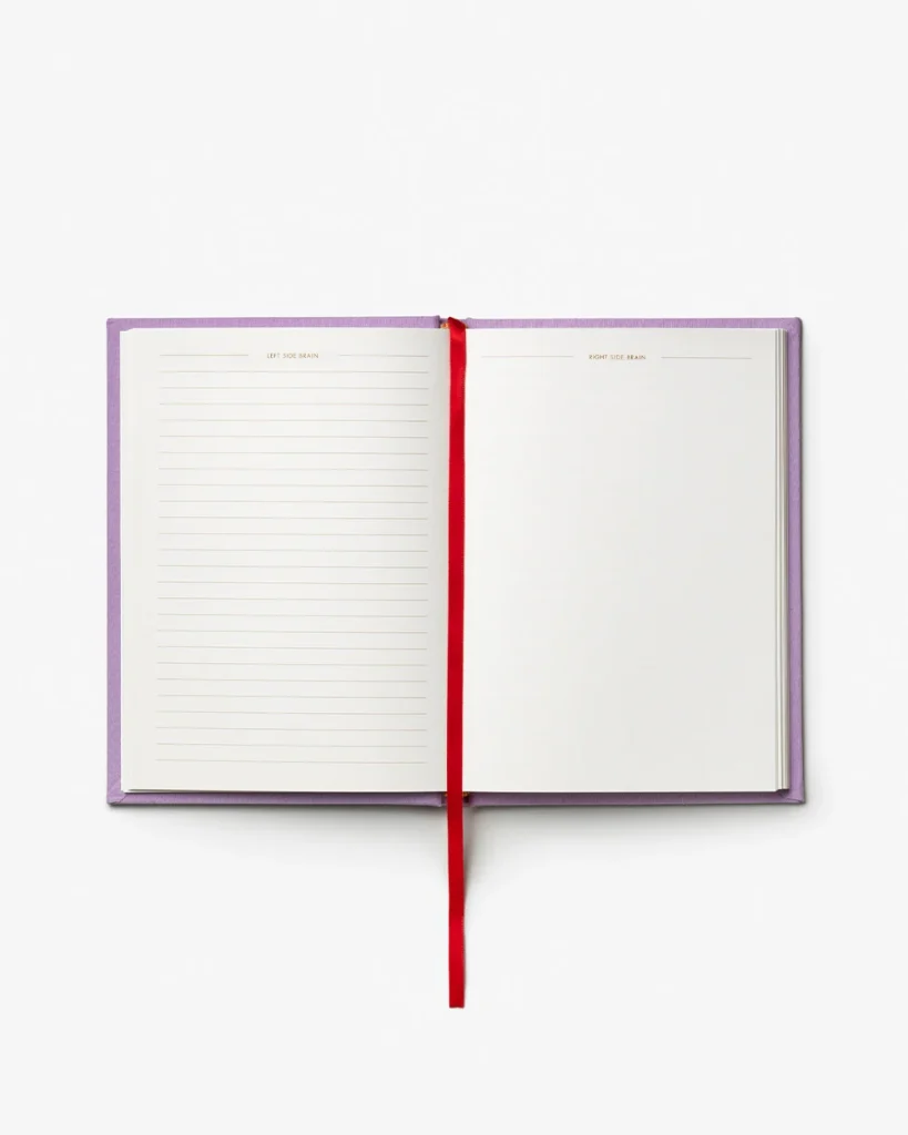 Open notebook with purple cover and red bookmark, left page lined, right page blank.