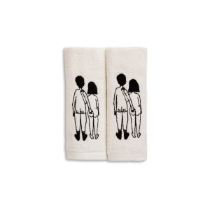 Pair of white towels featuring a black line-drawn couple holding hands, printed on each towel.