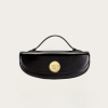 1 - New Trend Black leather handbag with a gold circular clasp on a pale background, centered in the image.