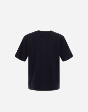 Back view of a plain black short-sleeve T-shirt against a light background, no visible logos