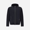 Navy zip-up hooded jacket with front pockets and elastic hem, shown front view.