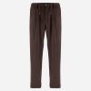 Brown relaxed-fit trousers with a drawstring waist and belt loops.